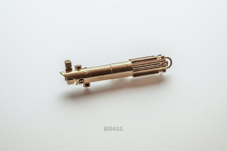 ShtokCustomWorx Mini Lightsaber Brass Pendant on a white background